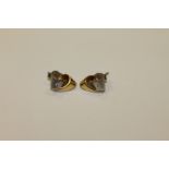 A pair of two-tone 18ct gold diamond set earrings (2)