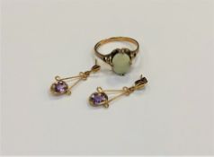 A gold and opal ring and a pair of gold amethyst earrings