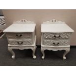 A pair of contemporary white two drawer bedside chests, width 50 cm.
