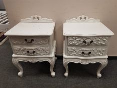 A pair of contemporary white two drawer bedside chests, width 50 cm.