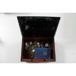 An antique metal cash box with key containing a large quantity of British pre decimal coins,