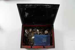 An antique metal cash box with key containing a large quantity of British pre decimal coins,