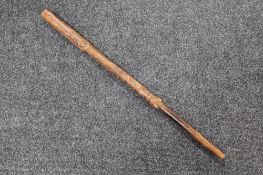 A carved tribal walking stick