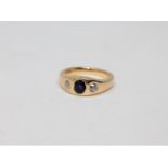 An 18ct gold diamond and sapphire three stone ring, size N CONDITION REPORT: 10.
