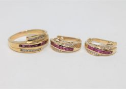 An 18ct gold diamond and ruby set ring, size R,