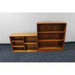 A set of teak open bookshelves together with set of teak wall shelves