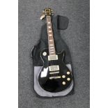 A Les Paul style electric guitar by Vintage,