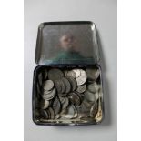 A tin of mid 20th century British coins, silver half crowns,