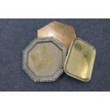 A brass Eastern octagonal tray together with a further brass tray and hexagonal brass stand