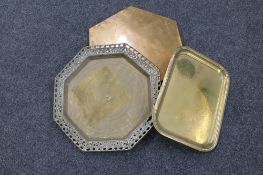 A brass Eastern octagonal tray together with a further brass tray and hexagonal brass stand