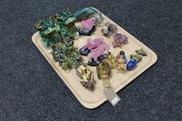 A tray of eastern wares, Chinese foo dogs, perfume bottles, resin figures of horses on plinths,