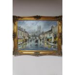 A gilt framed Denys Garle oil on canvas, Winter street scene,