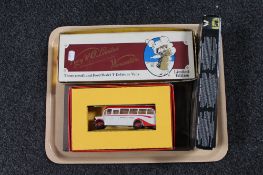 A tray of boxed Corgi and Lledo die cast buses and an album of train postcards