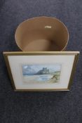 A gilt framed watercolour, Bamburgh Castle and beach by M.F.