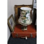 A 20th century luggage case together with a continental school oil on canvas still life,