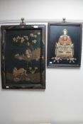 A framed Japanese relief panel depicting an emperor and a wall panel depicting a figure with a