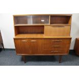 A mid century teak sideboard