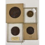 Four copper medallions in display boxes to include William Sandcroft 1678-1691,