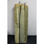 Four rolls of gold fabric