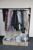 A rail of gent's suit trousers, jackets, two boxes of shirts, jumpers, some with tags,