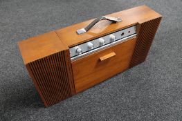 A Ferguson Stereo minor 3025 record player with drop down deck and detachable speaker