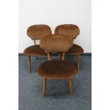 A set of three mid century dining chairs upholstered in brown dralon