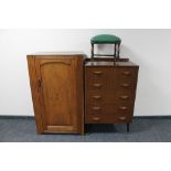 A walnut linen chest together with a mid century five drawer chest and leather footstool