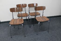 A set of four mid century melamine dining chairs on metal legs
