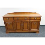 A Ducal pine four door sideboard