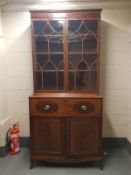 A George III inlaid mahogany bureau boockase, width 110 cm.