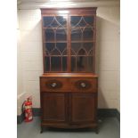 A George III inlaid mahogany bureau boockase, width 110 cm.