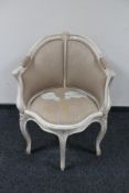 A contemporary French style painted framed elbow chair
