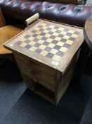 An oak and pine six drawer chest with chess board top