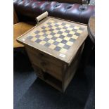 An oak and pine six drawer chest with chess board top