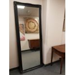 A traditional style black framed mirror,