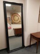 A traditional style black framed mirror,