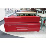 A two piece Ikea red high gloss entertainment stand