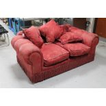 A two seater Victorian style settee in red brocade