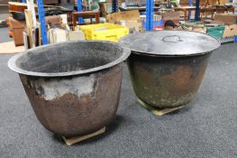 Two cast iron smelting pots, one with lid.