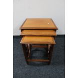 A nest of three teak G-plan tables