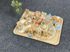 A tray of sixteen Pendelfin figures, two stands.