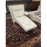 A contemporary cream leather chaise longue,