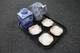 A Ringtons Maling blue and white water jug together with a Ringtons willow pattern tea caddy and a