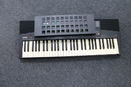 A Yamaha PSR-215 electric keyboard with lead