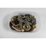 A quantity of costume jewellery, brooches, bangles,