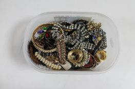 A quantity of costume jewellery, brooches, bangles,