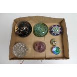A box of seven assorted glass and crystal paperweights