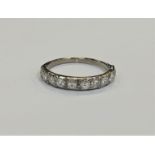 An antique platinum half eternity ring, the total diamond weight estimated at 0.