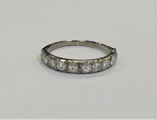 An antique platinum half eternity ring, the total diamond weight estimated at 0.