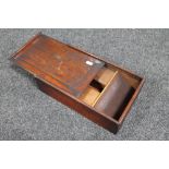 an antique pine box with slide lid